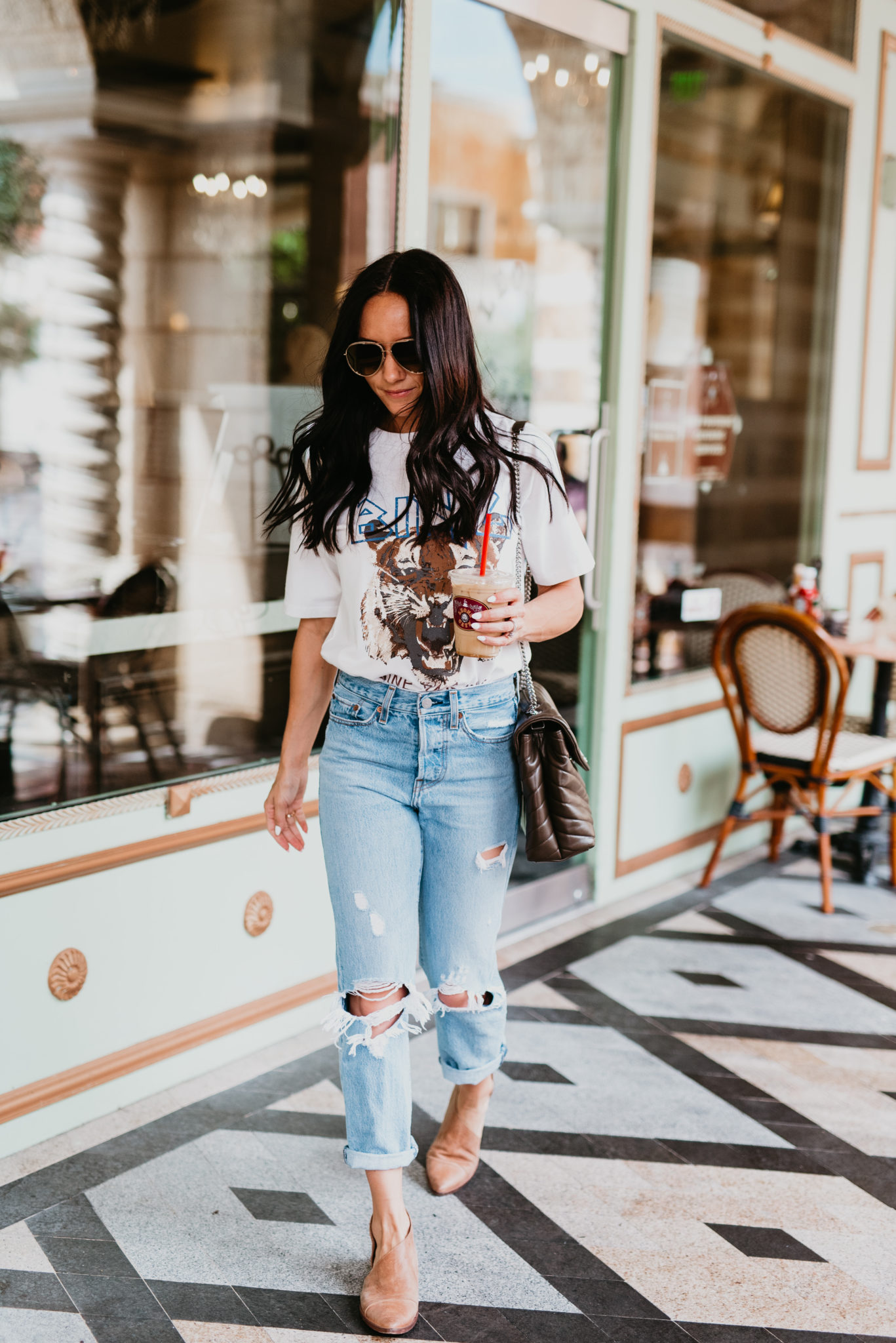 How to Wear a Graphic Tee this Fall, styling tips featured by top US fashion blog, Outfits & Outings: image of a woman wearing an Anime Bing tiger graphic tee, Levi’s wedgie jeans, Free People flats, Saint Laurent shoulder bag, Jimmy Choo aviator sunglasses
