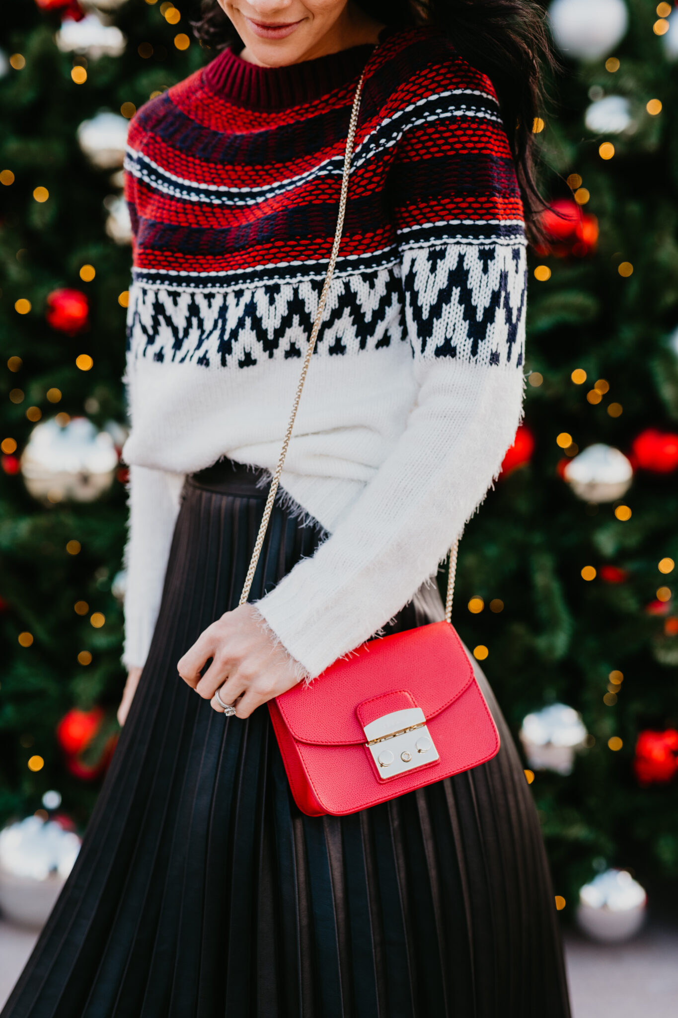 Festive Christmas Outfit Ideas featured by top US fashion blog, Outfits & Outings: image of a woman wearing a BB Dakota Fairisle Sweater