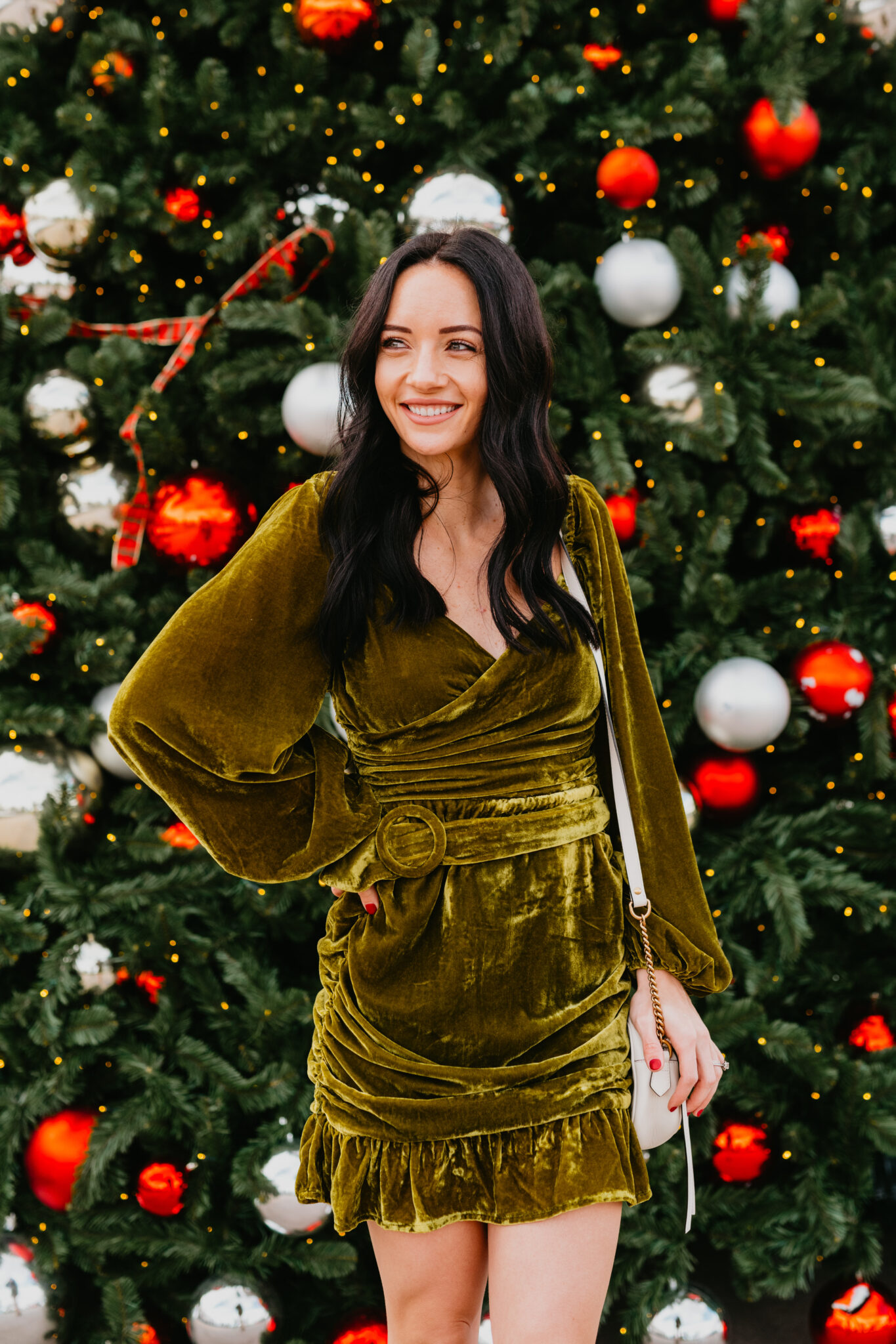 Festive Christmas Outfit Ideas featured by top US fashion blog, Outfits & Outings: image of a woman wearing a Tularosa velvet mini dress