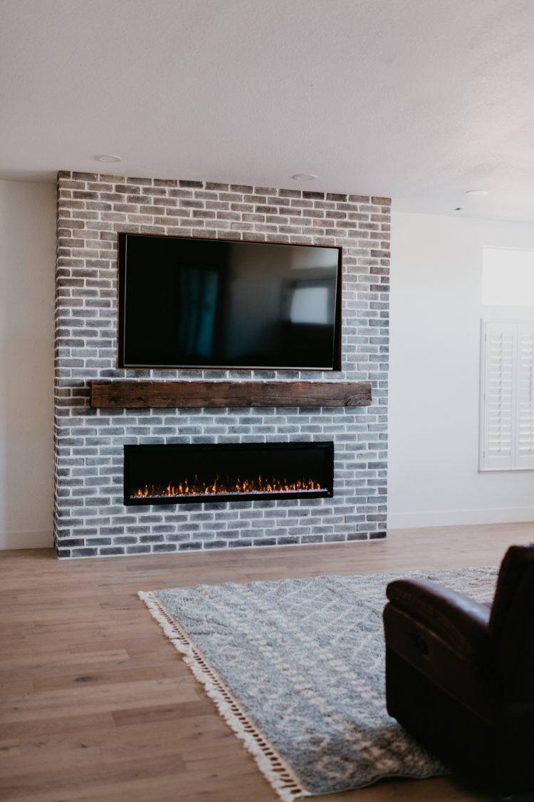 Gray Brick Fireplace home project featured by top Las Vegas lifestyle blog, Outfits & Outings.
