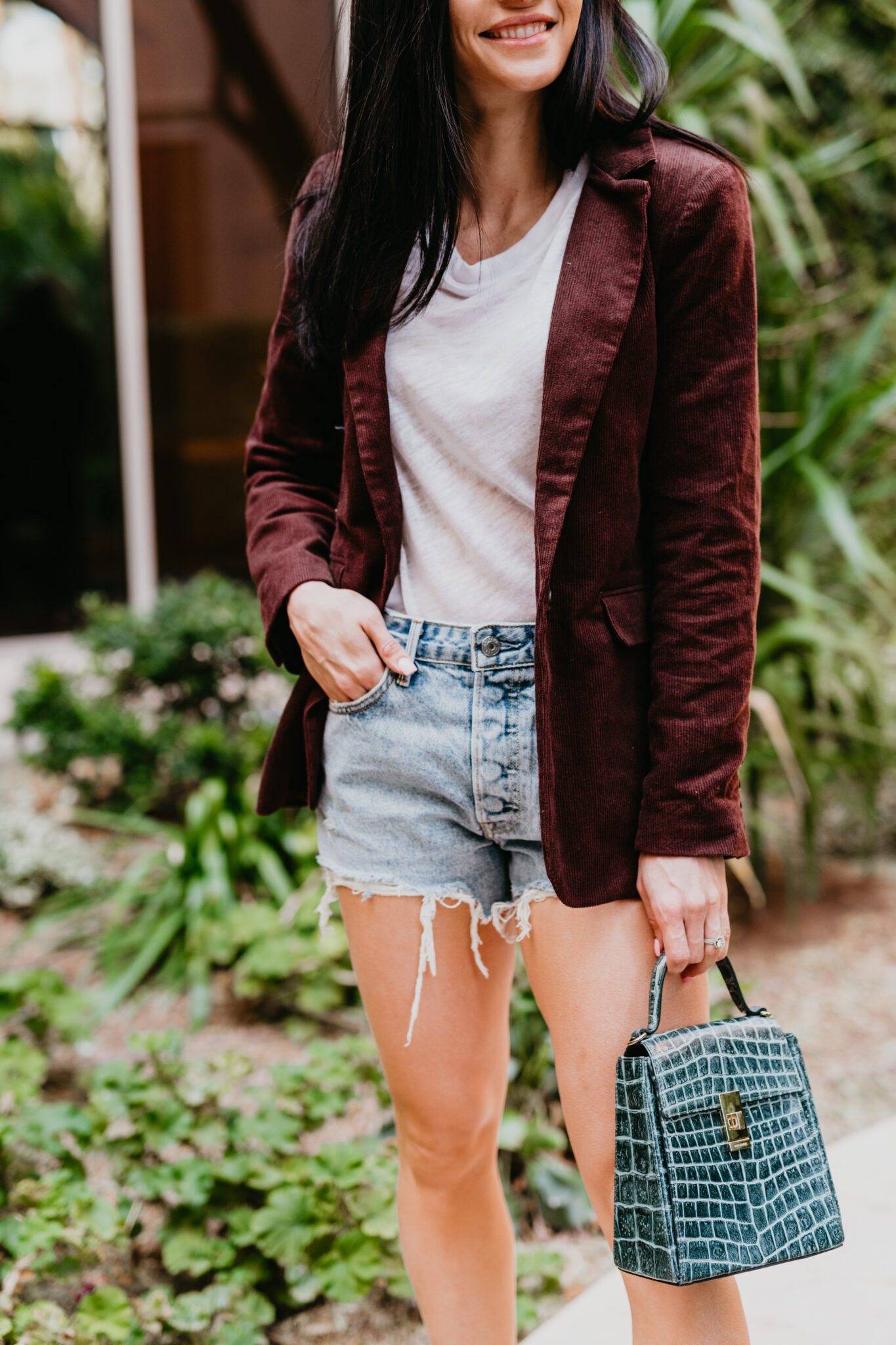 What to wear with denim shorts in the Spring, denim shorts outfit ideas featured by top Las Vegas fashion blog, Outfits & Outings: image of a woman wearing GRLFRND denim shorts 
