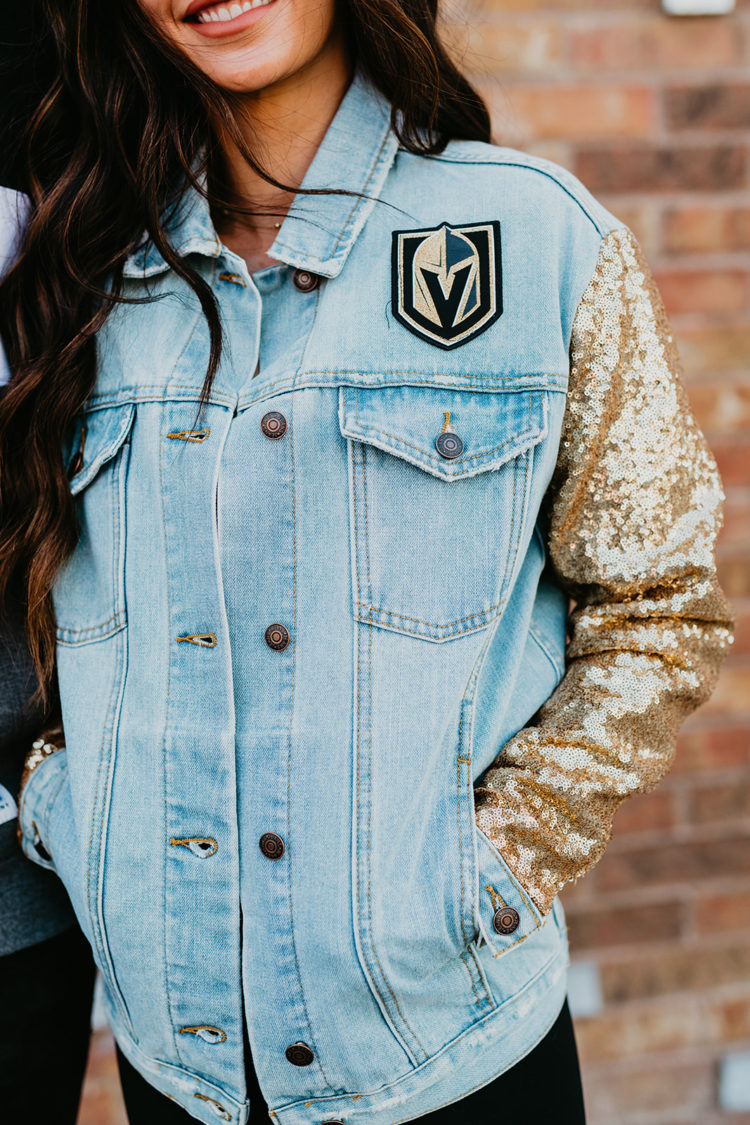 Golden Knights Gear by popular Las Vegas fashion blog, Outfits and Outings: image of a woman wearing a gold sequin sleeve denim Golden Knights jacket. 