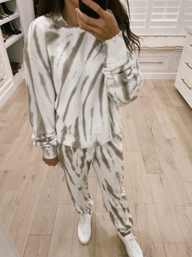 Nordstrom Anniversary Sale 2021 by popular Las Vegas fashion blog, Outfits and Outings: image of a woman wearing a grey and white loungewear set with a pair of white sneakers. 
