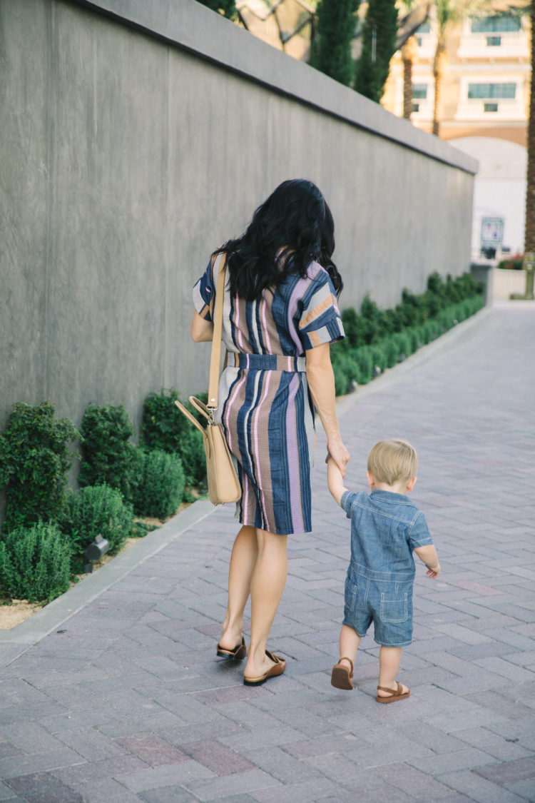 mom and toddler walking
