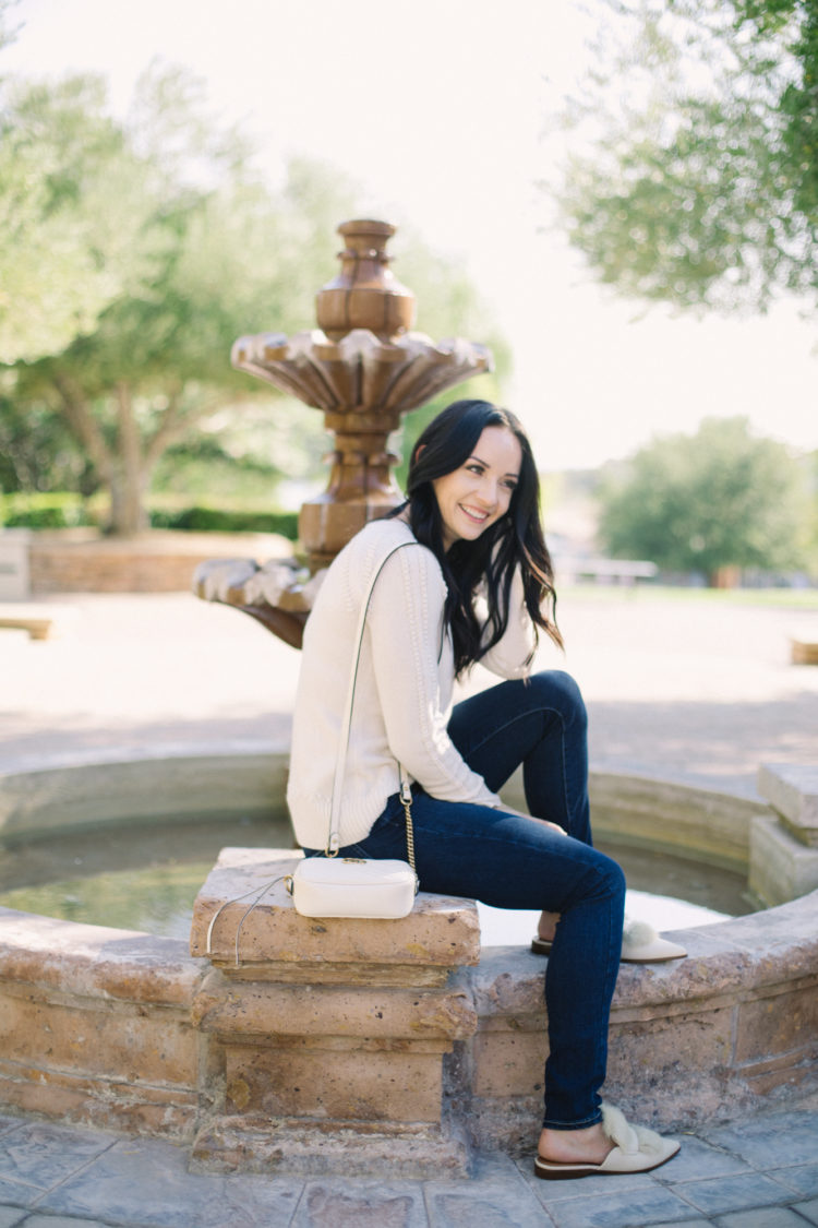 mules outfit with jeans and cream sweater