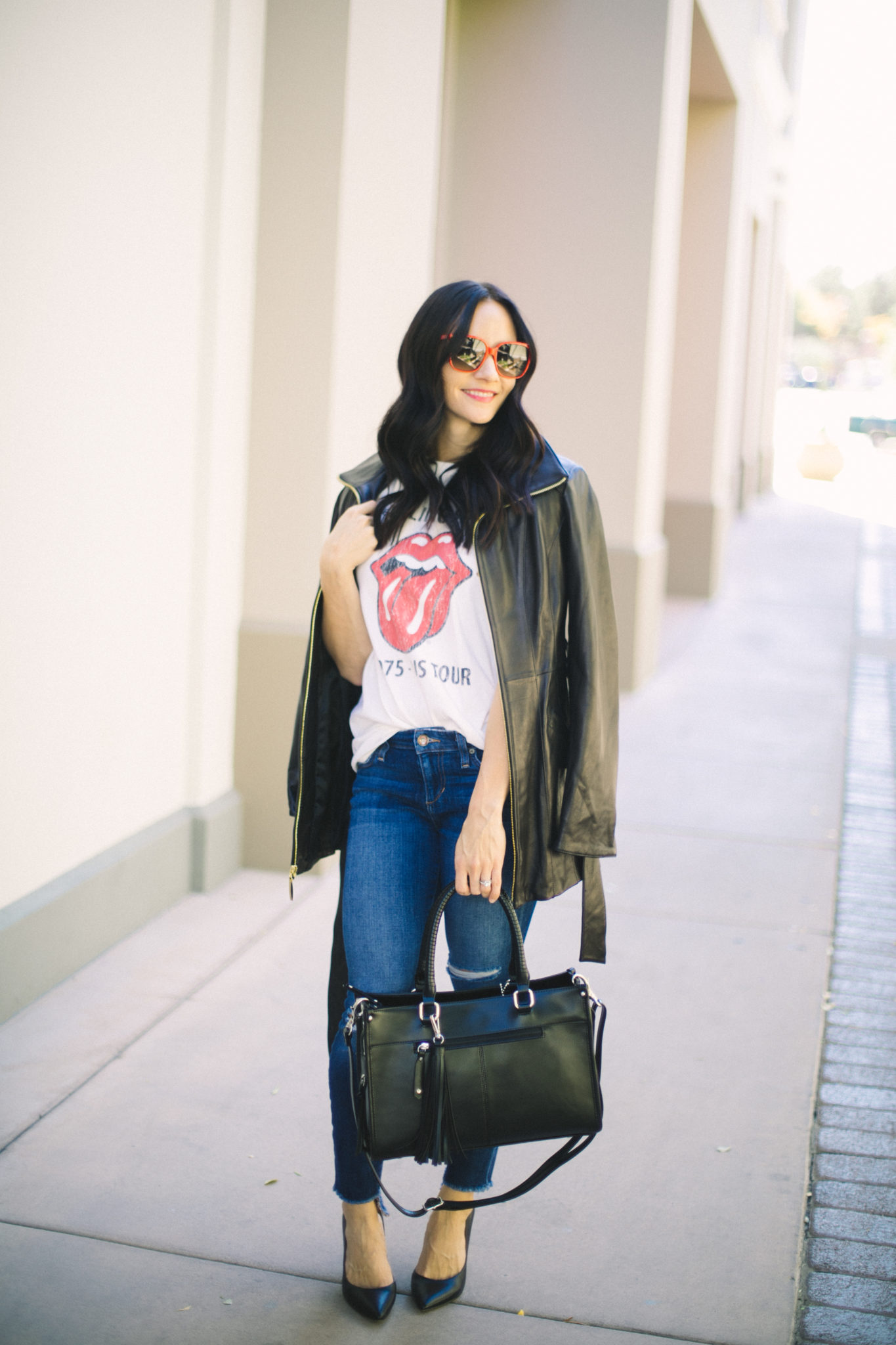 fall leather jacket idea: vintage band tee, ripped jeans, caped leather jacket 