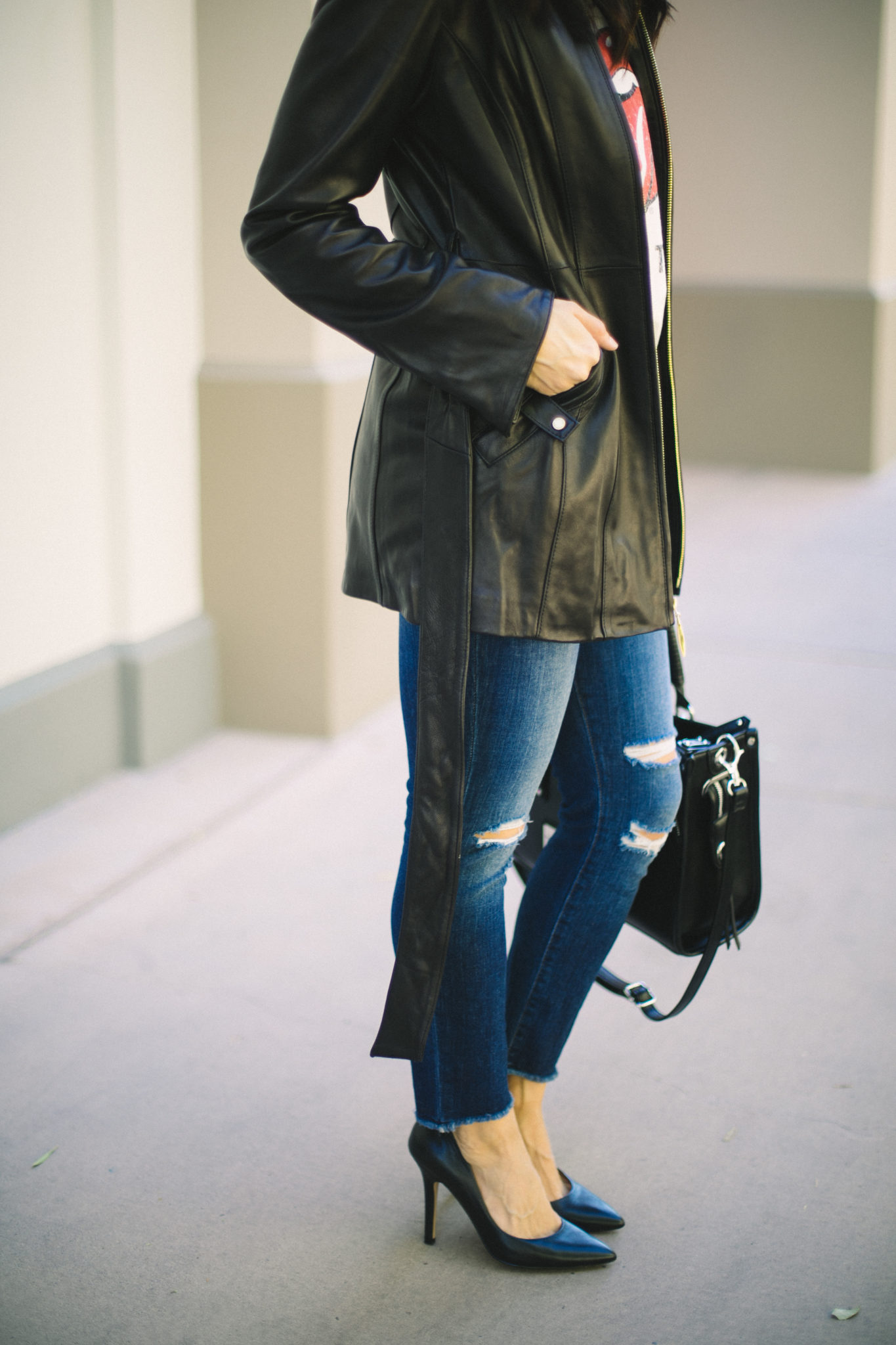 leather jacket ripped jeans and black pumps