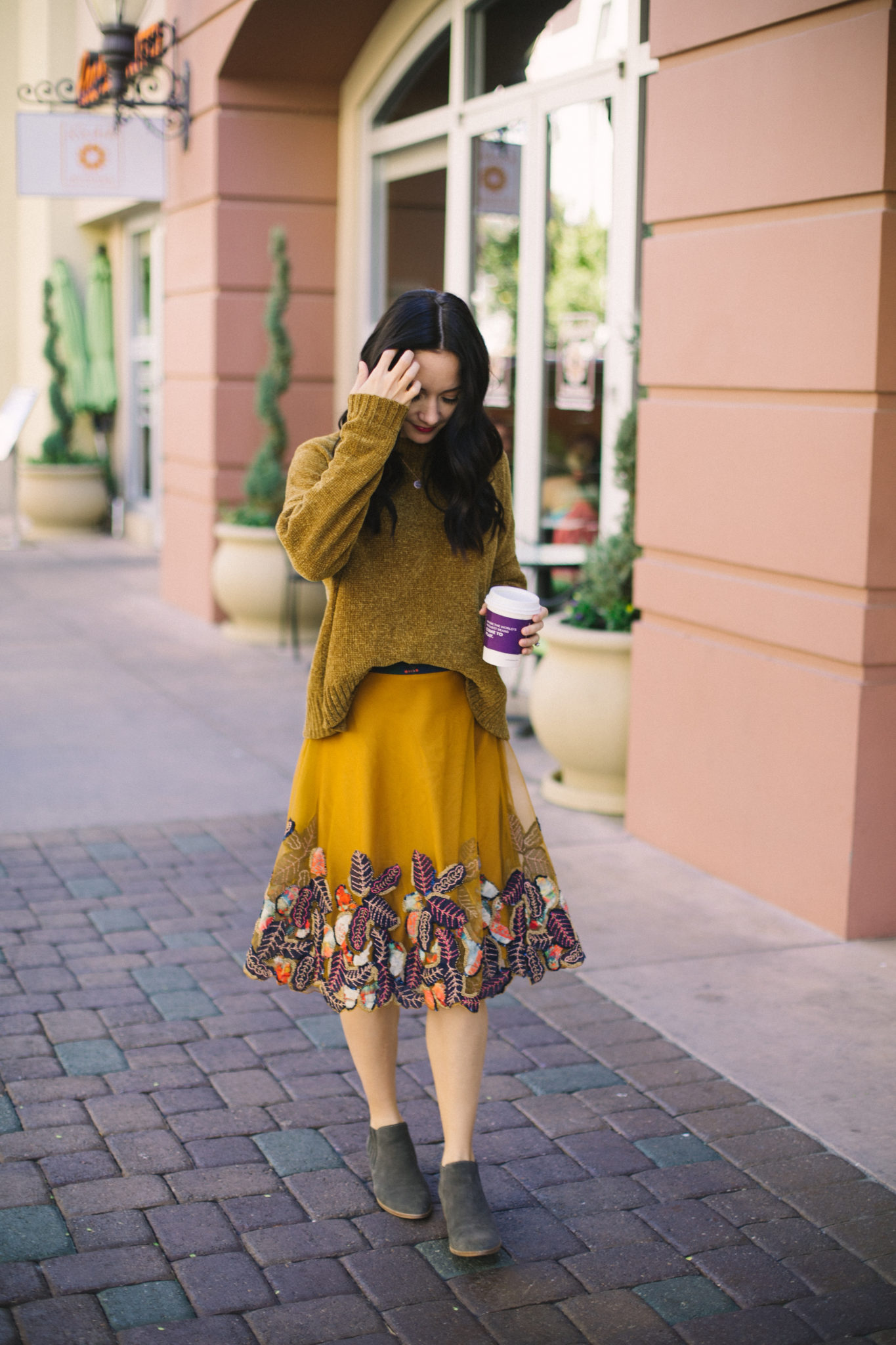 monochromatic outfit mustard yellow skirt and sweater