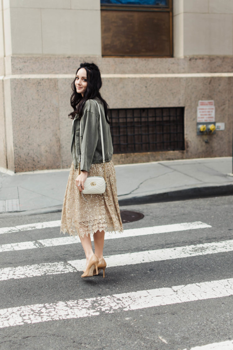 cargo jacket with gold lace skirt and white Gucci marmont bag