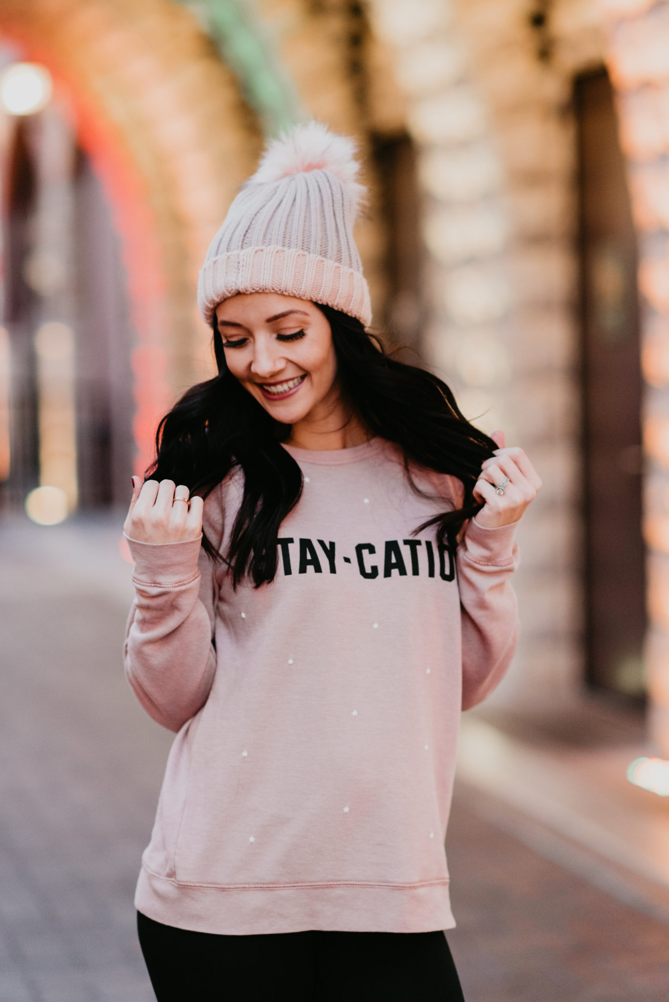 stay-cation sweater and pink beanie - 15 Ways to Treat Yourself by popular Las Vegas style blogger Outfits & Outings