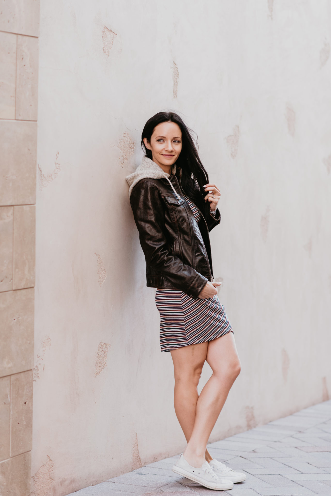 Brunette wearing a Wilsons hooded leather jacket, Converse sneakers featured by top Las Vegas fashion blog, Outfits & Outings