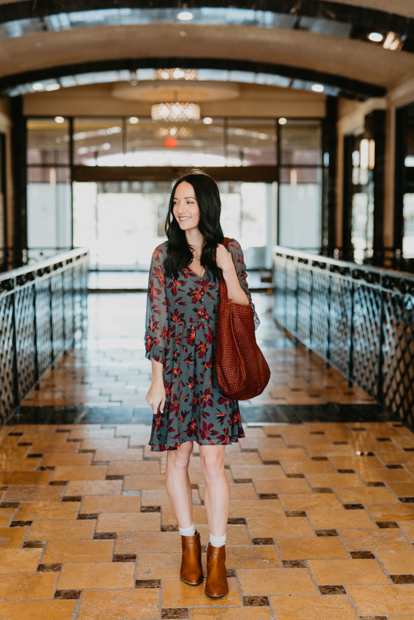 Cute Spring dress look styled by top US fashion blog, Outfits & Outings: image of a woman wearing a Madewell ruffle sleeve dress, and Madewell booties