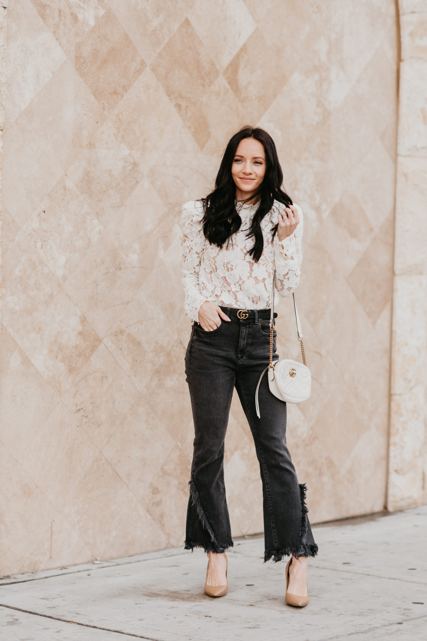 Cute white lace top styled for Spring for top US fashion blog, Outfits & Outings: image of a woman wearing a WAYF white lace top, DL1961 cropped flared jeans, Gucci double g leather belt, Gucci marmot bag and Charles David toe pumps
