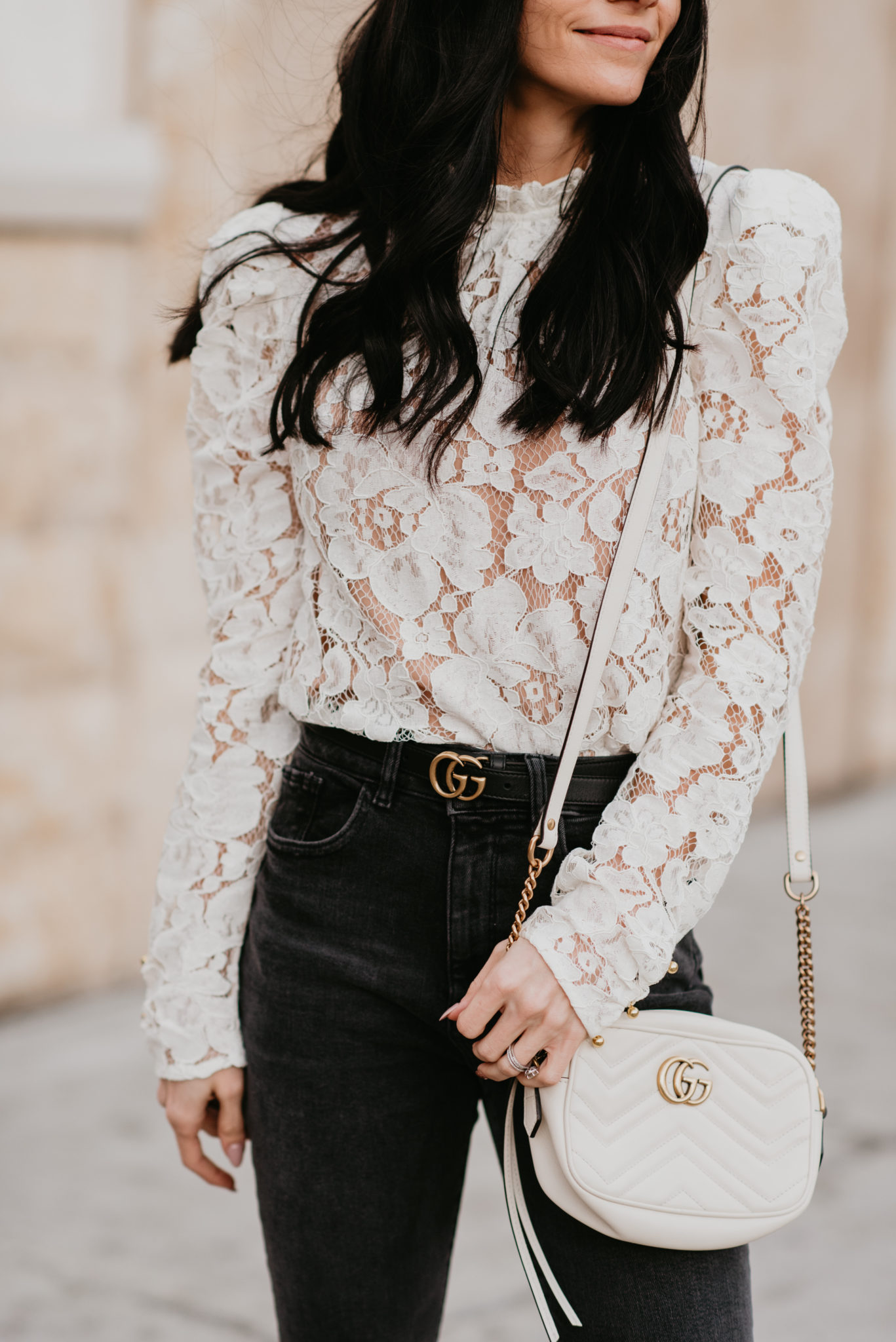 Cute white lace top styled for Spring for top US fashion blog, Outfits & Outings: image of a woman wearing a WAYF white lace top, DL1961 cropped flared jeans, Gucci double g leather belt, Gucci marmot bag and Charles David toe pumps