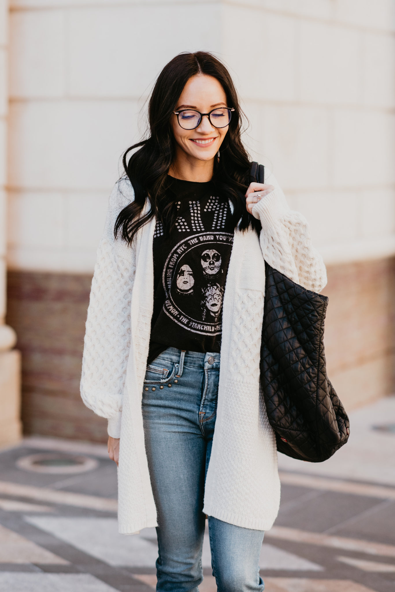 Cute Spring Tees Roundup featured by top US fashion blog, Outfits & Outings: image of a woman wearing a John Varvatos KISS graphic tee.