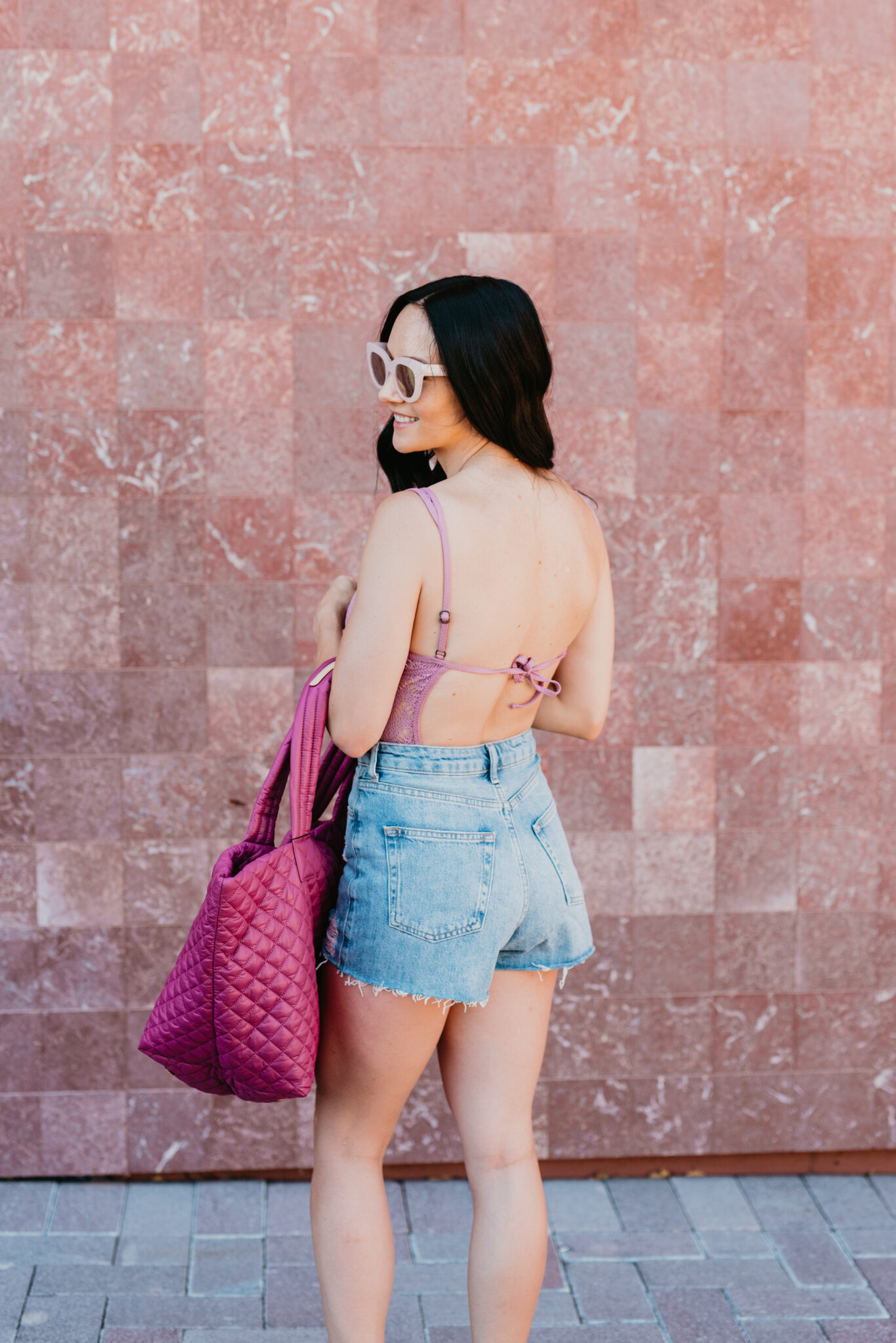 Denim Shorts Styles featured by top US fashion blog, Outfits & Outings: image of a woman wearing TOPSHOP mom denim shorts
