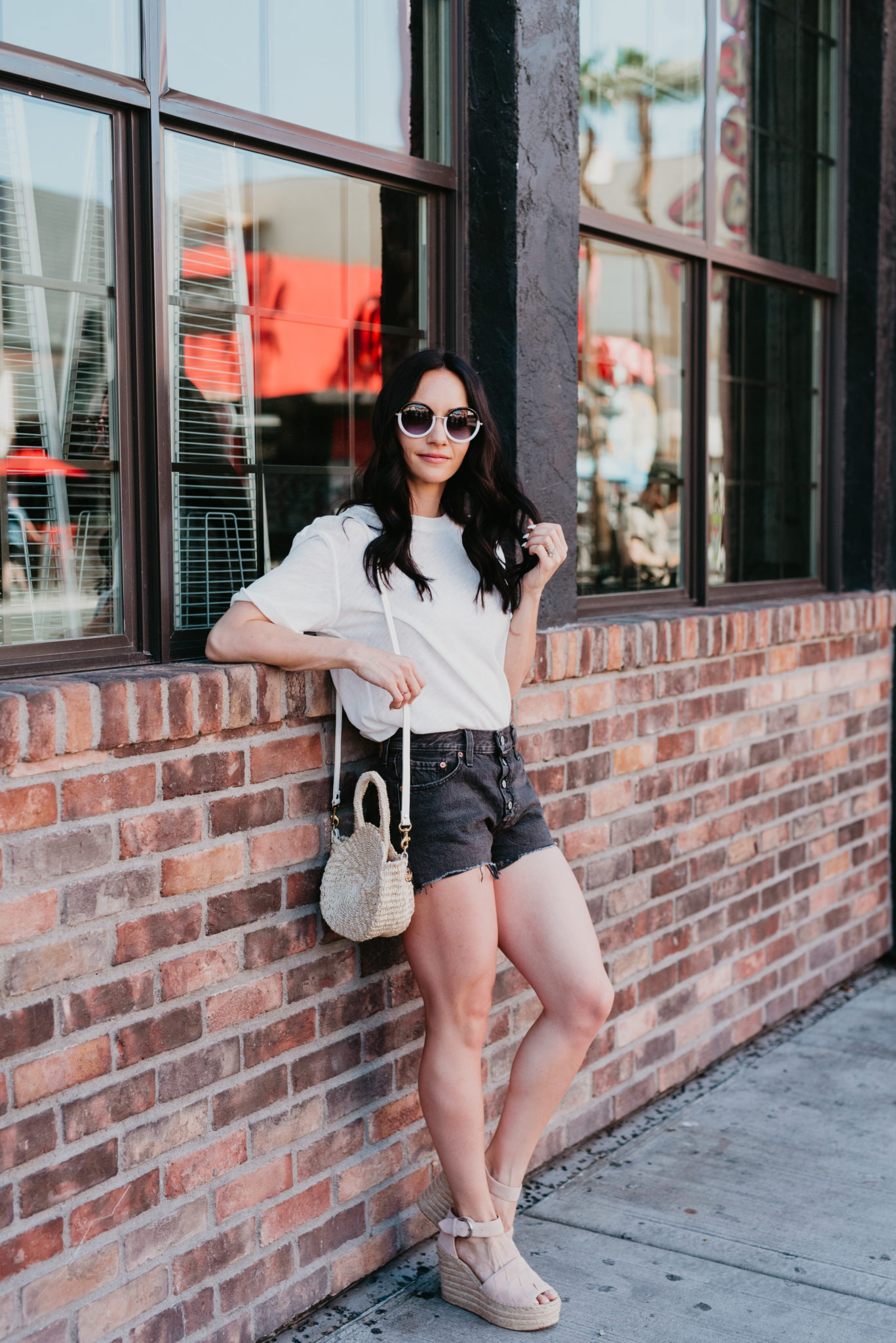Nordstrom Spring Sale favorites featured by top US fashion blog, Outfits & Outings: image of a woman wearing a FREE PEOPLE tee, Levi’s Cutoff Denim Shorts, and Marc Fisher Espadrille Wedges