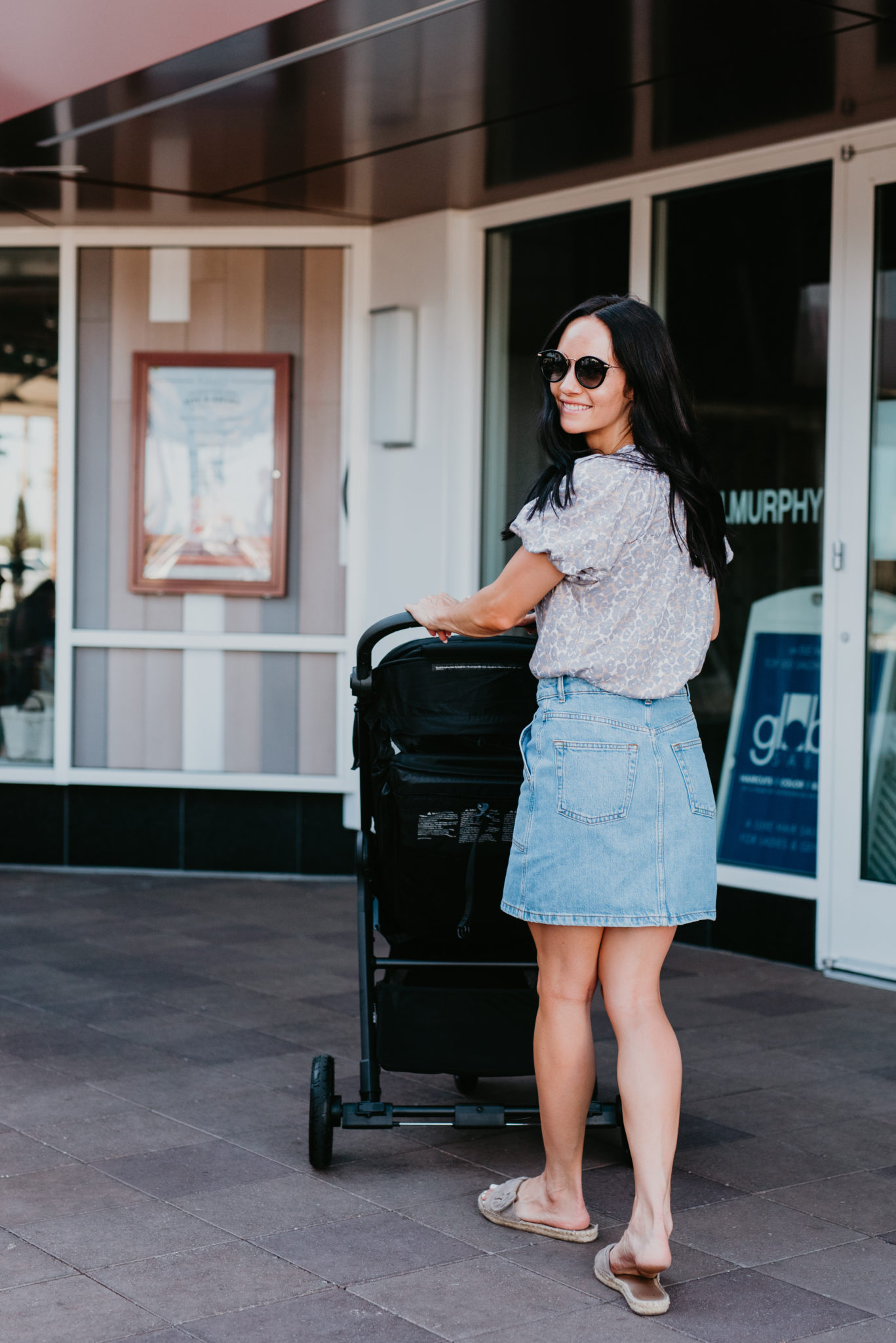 Family summer fun featured by top US life and style blog, Outfits & OutingsL image of a woman pushing the Baby Jogger city mini GT2
