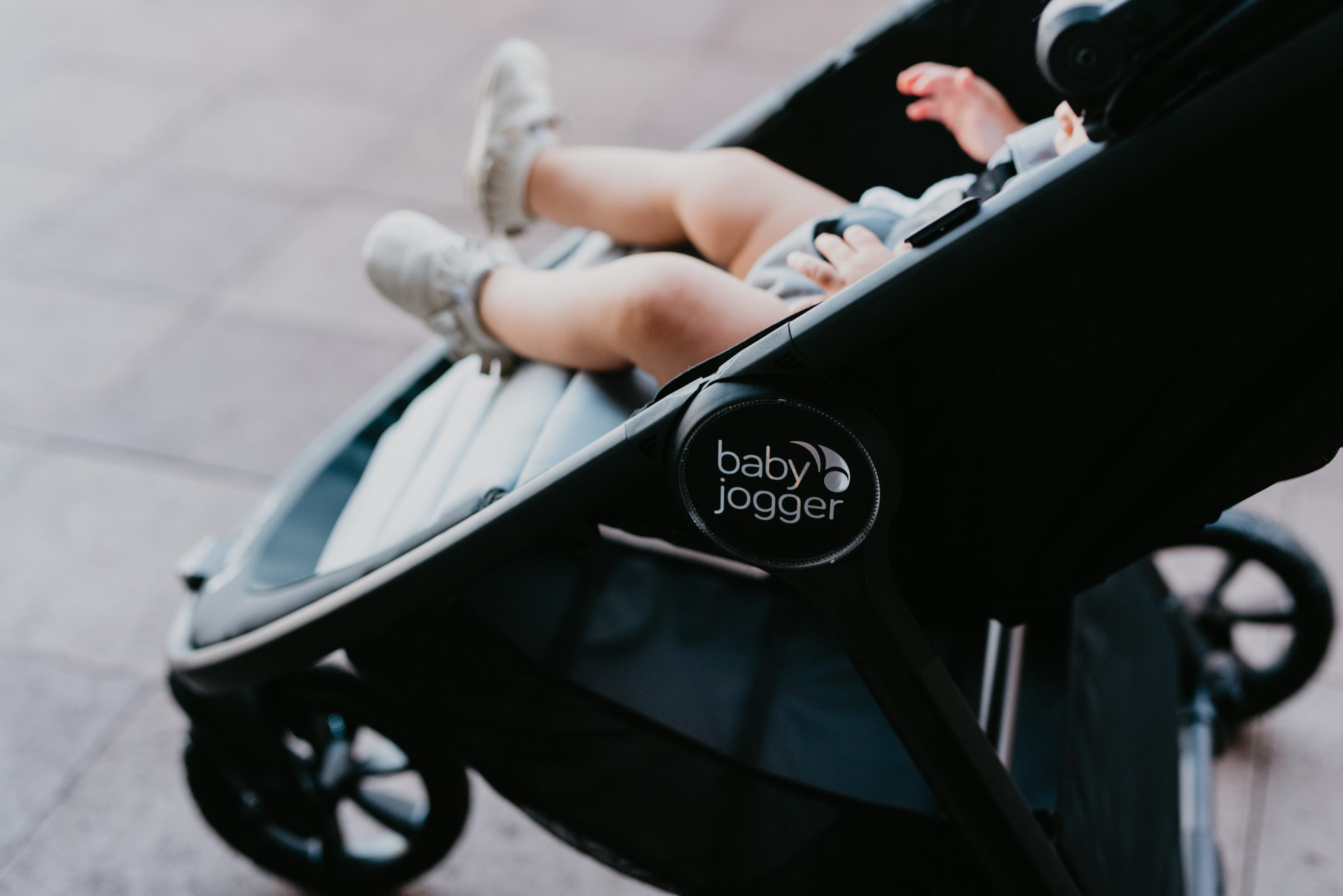 Family summer fun featured by top US life and style blog, Outfits & OutingsL image of a toddler in the Baby Jogger city mini GT2