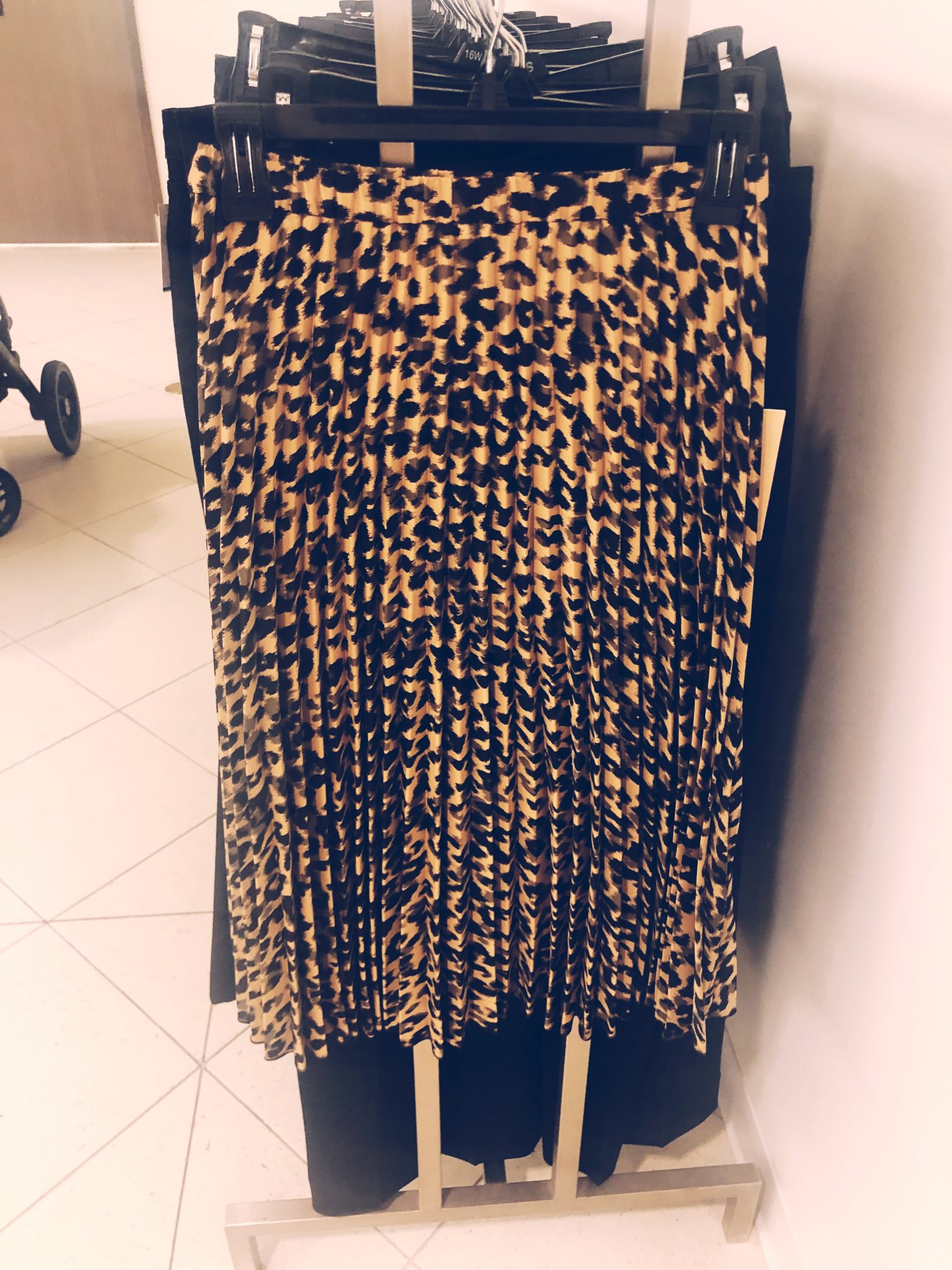 Nordstrom Anniversary Sale Sneak Peek featured by top US fashion blog, Outfits & Outings: leopard pleated skirt