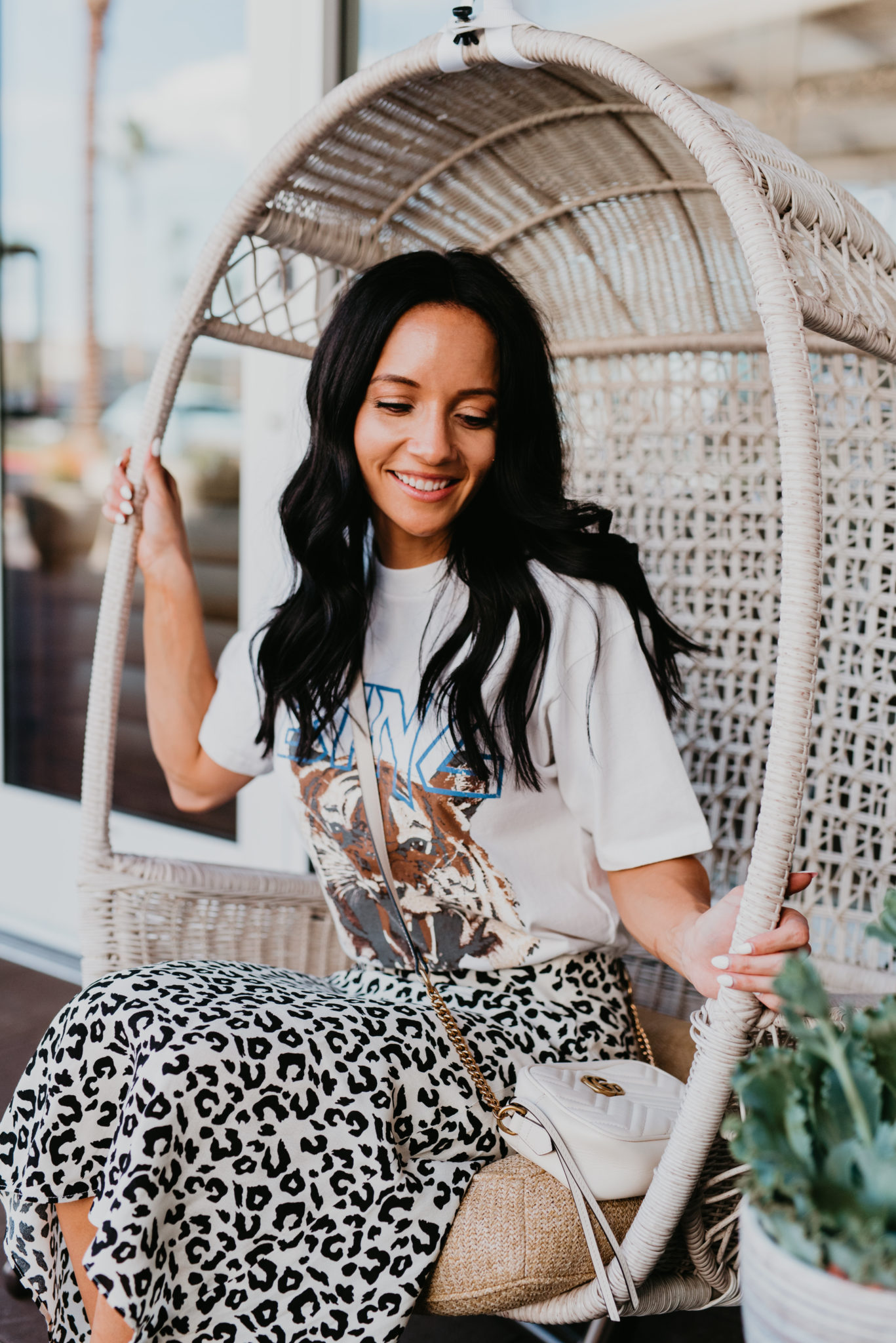 How to Wear a Graphic Tee this Fall, styling tips featured by top US fashion blog, Outfits & Outings: image of a woman wearing an Anime Bing tiger graphic tee, Aqua slip skirt, Gucci GG Marmont Matelasse, Marc Fisher platform wedge espadrilles