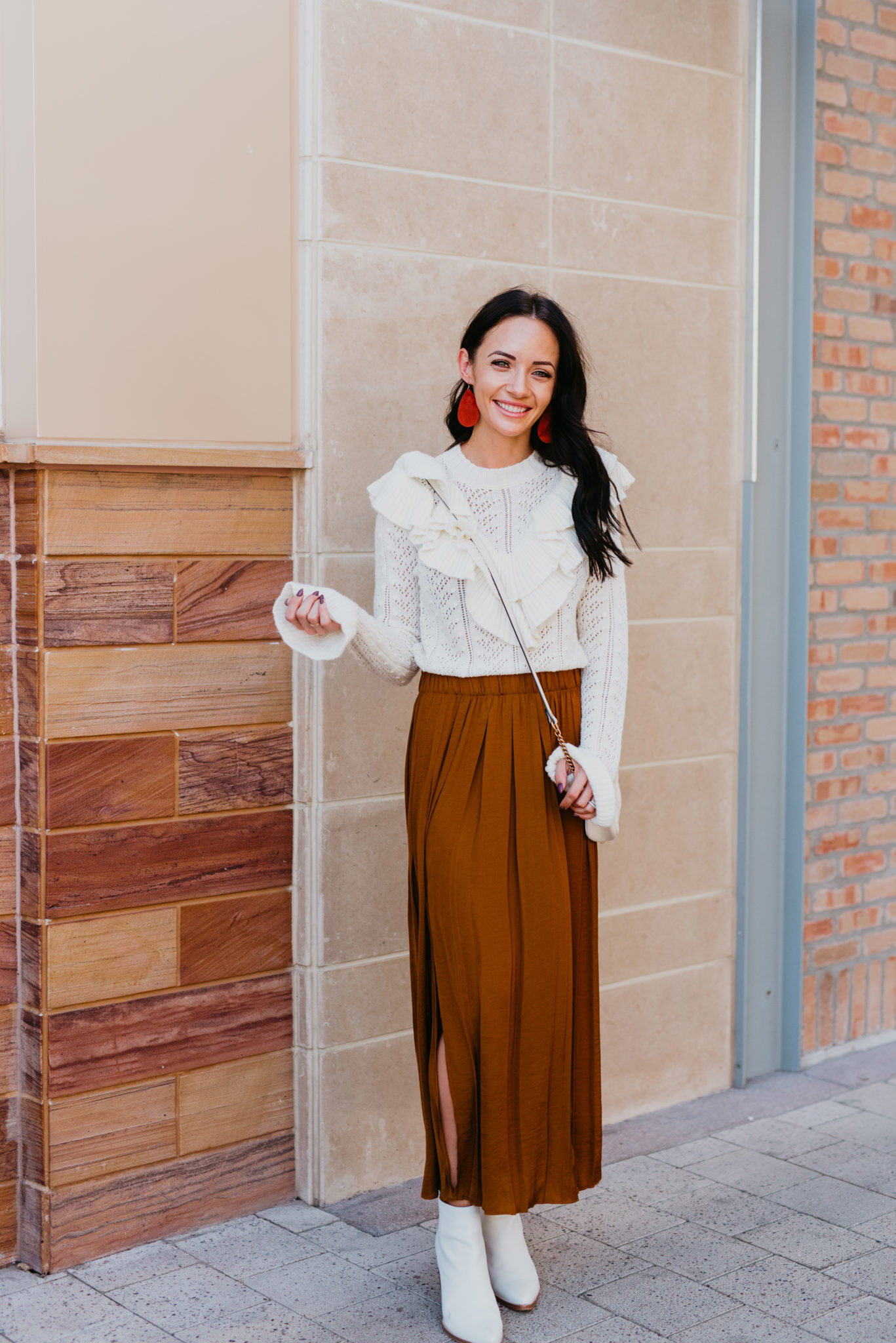 Fall Color Trends featured by top US fashion blog, Outfits & Outings: image of a woman wearing a rust maxi skirt