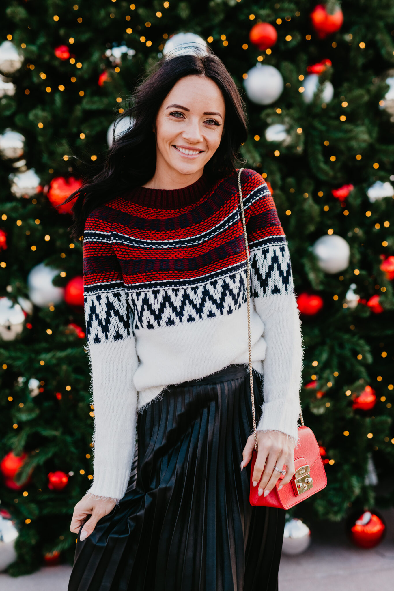 Festive Christmas Outfit Ideas featured by top US fashion blog, Outfits & Outings: image of a woman wearing a BB Dakota Fairisle Sweater