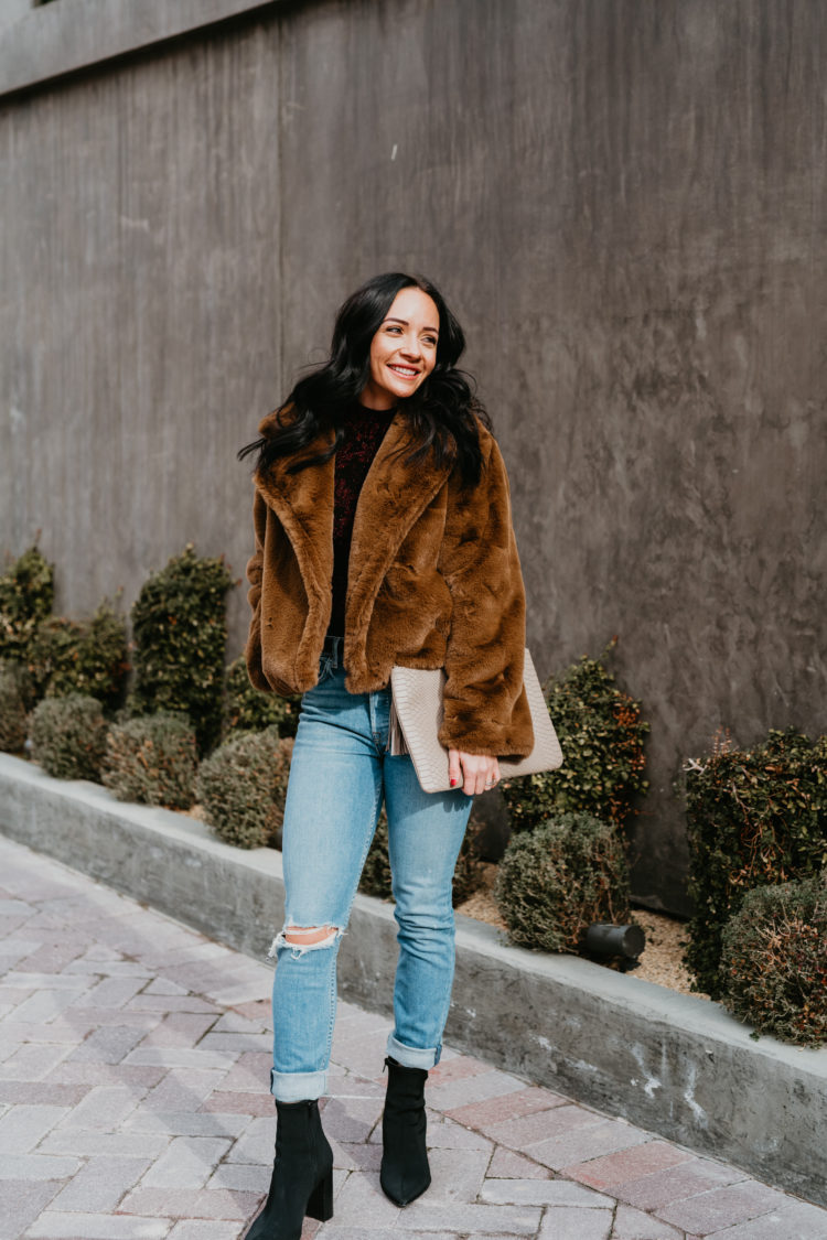 Best Presidents Sales by popular Las Vegas fashion blog, Outfits and Outings: image of a woman wearing Nordstrom Wedgie Ripped Straight Leg Jeans LEVI'S®, BB Dakota BIG TIME PLUSH FAUX FUR JACKET, and Nordstrom Daith Pointed Toe Bootie MARC FISHER LTD.