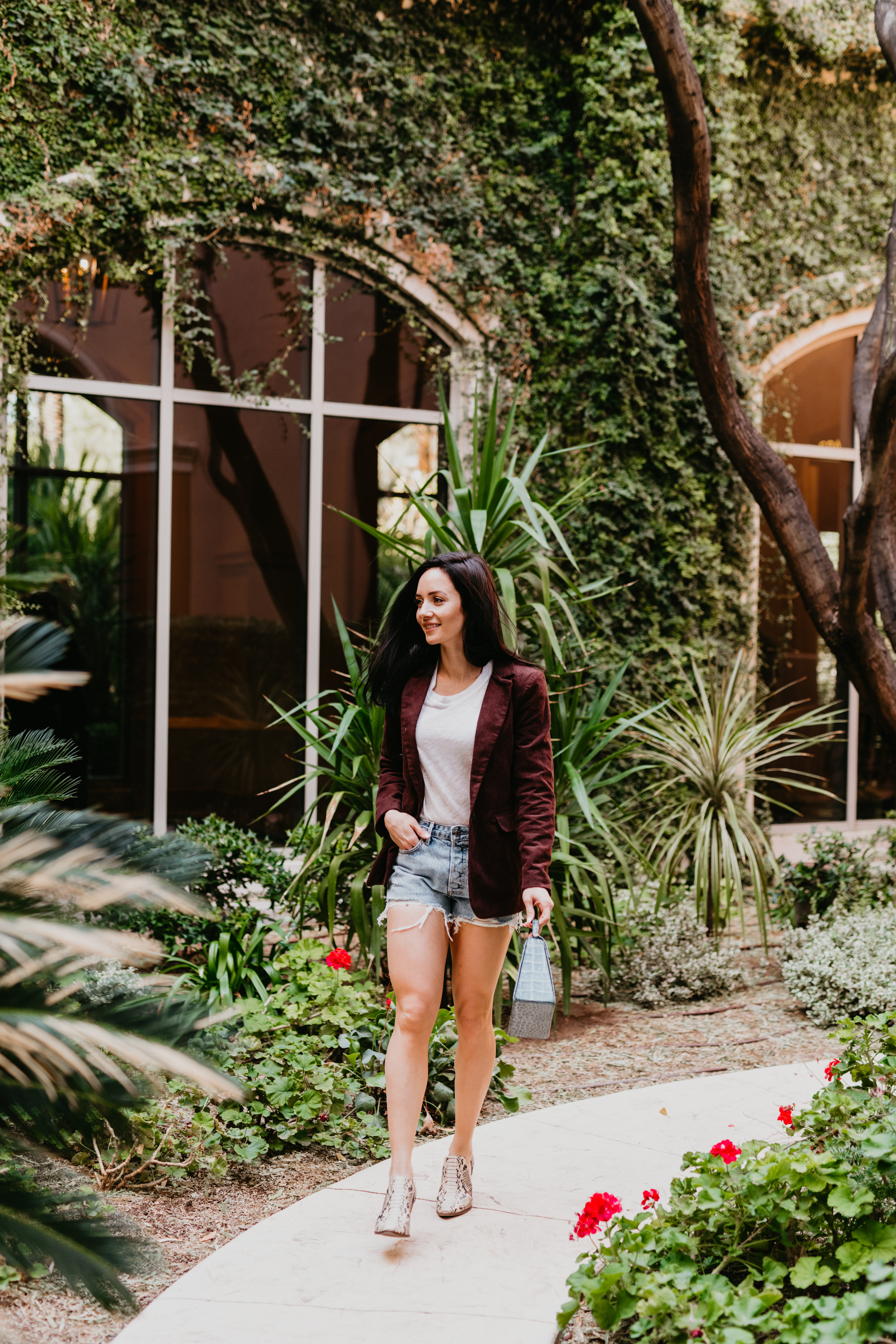 What to wear with denim shorts in the Spring, denim shorts outfit ideas featured by top Las Vegas fashion blog, Outfits & Outings: image of a woman wearing GRLFRND denim shorts 