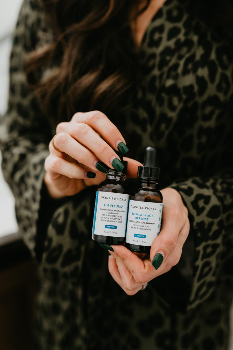 Acne and Anti Aging Skincare Routine by popular Las Vegas beauty blog, Outfits and Outings: image of a woman holding Skin Ceuticals blemish and age defense. 