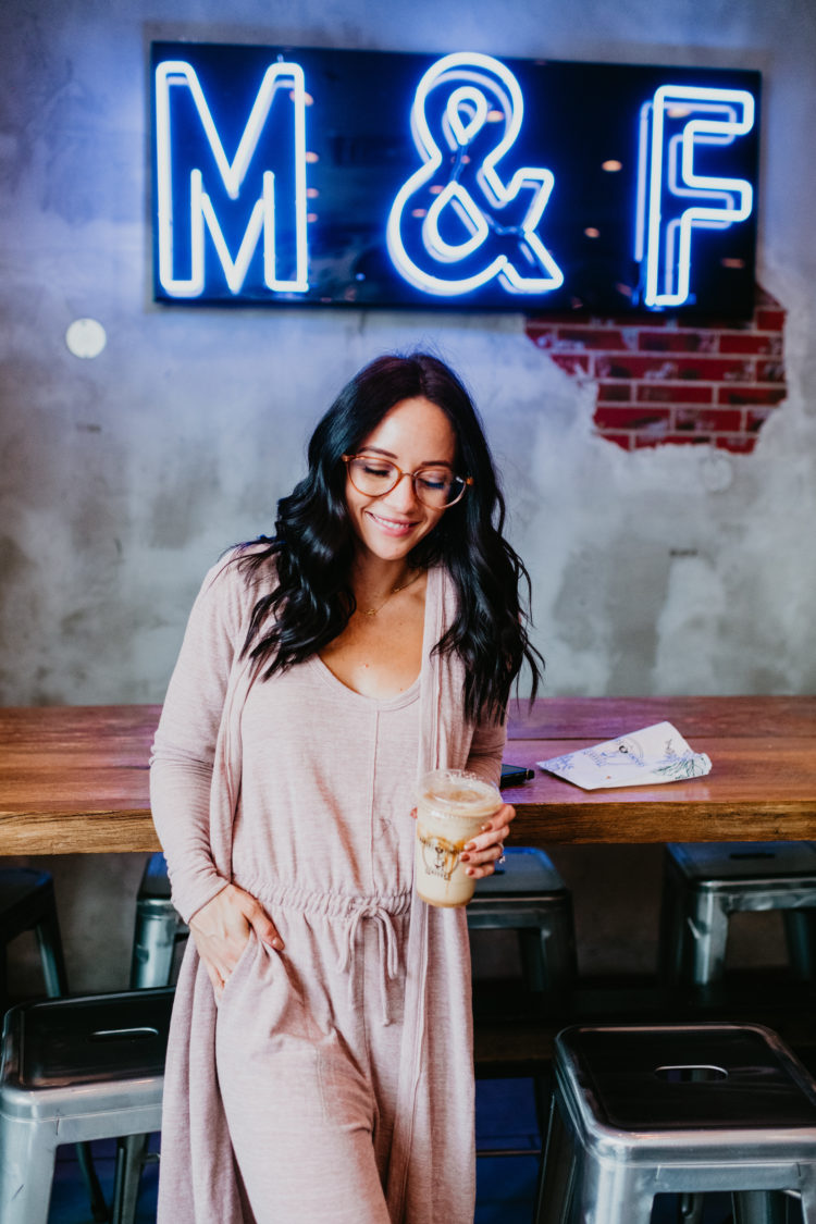 Matching Lounge Sets by popular Las Vegas fashion blog, Outfits and Outings: image of a woman wearing a pink matching lounge set in a coffee shop. 
