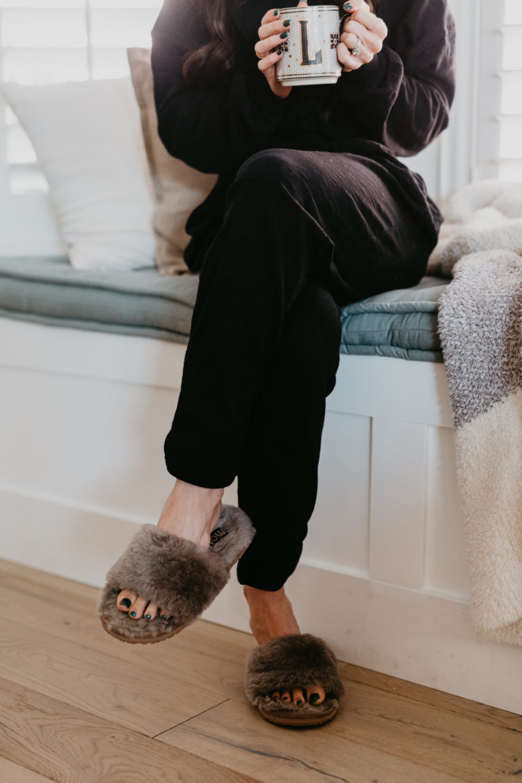Matching Lounge Sets by popular Las Vegas fashion blog, Outfits and Outings: image of a woman black matching lounge set and grey faux fur slippers. 