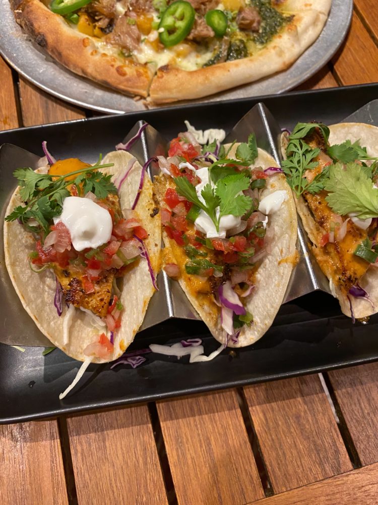 Best Restaurants in Maui by popular Las Vegas travel blog, Outfits and Outings: image of a Kahlua pizza and fish tacos. 