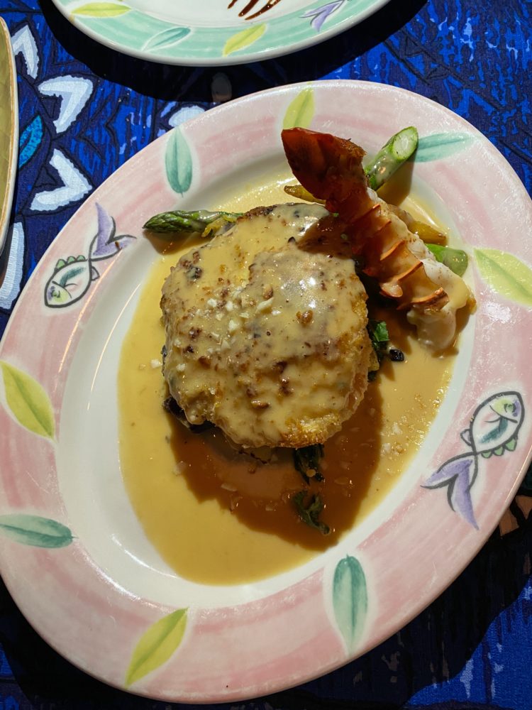 Best Restaurants in Maui by popular Las Vegas travel blog, Outfits and Outings: image of coconut crusted Maui Maui and a lobster tail and some asparagus. 