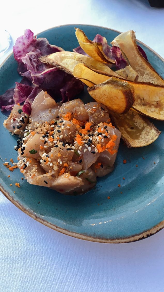 Best Restaurants in Maui by popular Las Vegas travel blog, Outfits and Outings: image of a plate of plantain chips, red cabbage, and Mahi Mahi. 