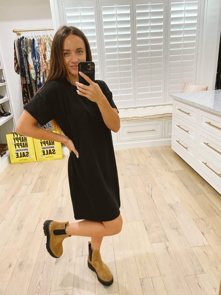 Nordstrom Anniversary Sale 2021 by popular Las Vegas fashion blog, Outfits and Outings: image of a woman wearing black t-shirt dress with a pair of brown sueded ankle boots. 
