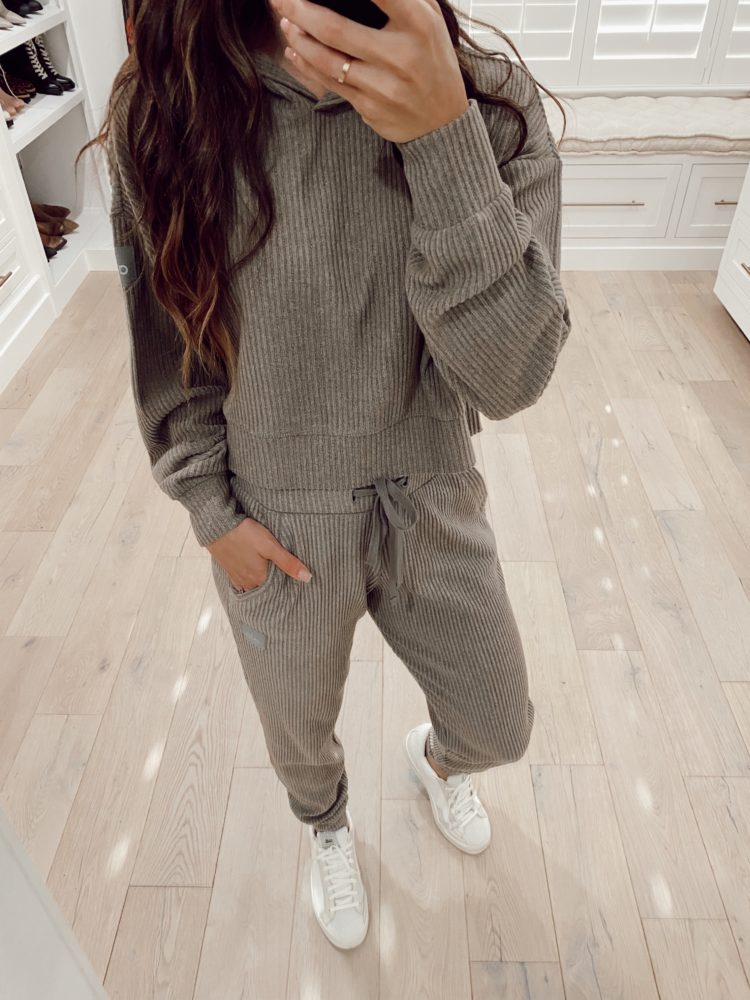Nordstrom Anniversary Sale 2021 by popular Las Vegas fashion blog, Outfits and Outings: image of a woman wearing a pair of white sneakers with a grey rib knit loungewear set. 