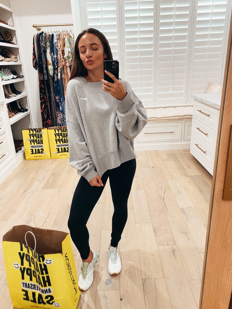 Nordstrom Anniversary Sale 2021 by popular Las Vegas fashion blog, Outfits and Outings: image of a woman wearing grey nike sweatshirt, black leggings and white sneakers. 