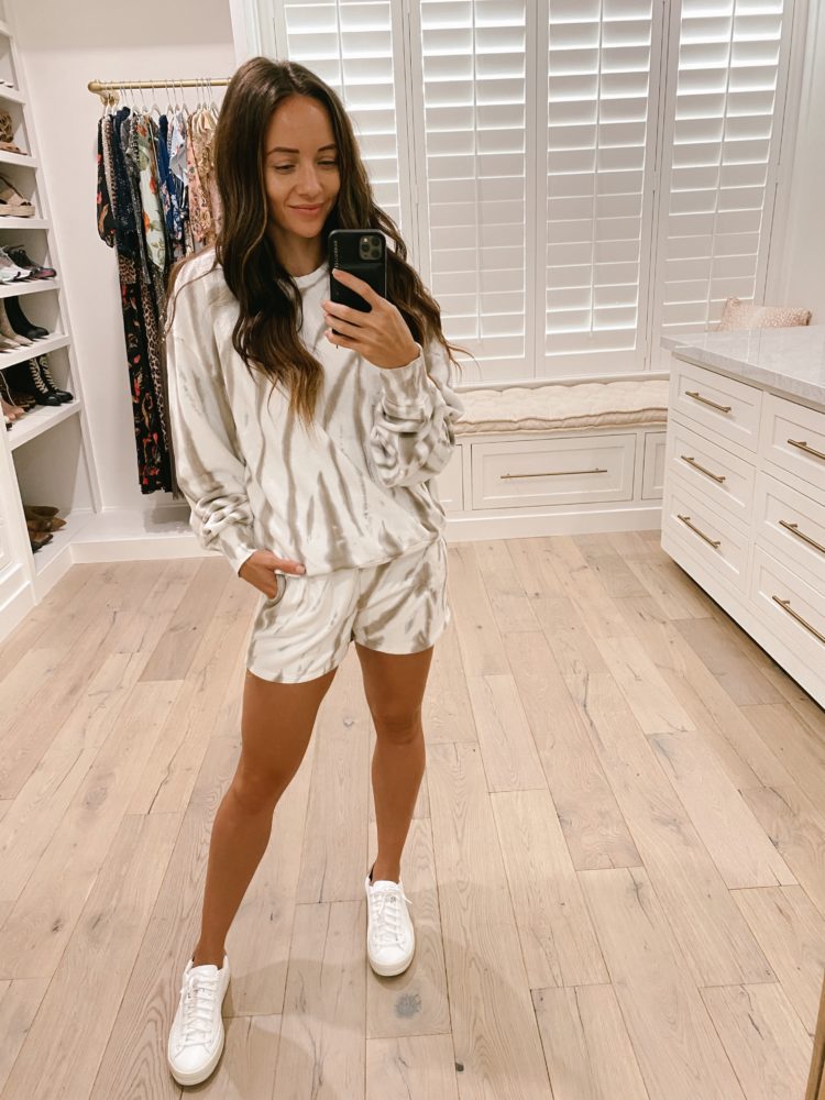 Nordstrom Anniversary Sale 2021 by popular Las Vegas fashion blog, Outfits and Outings: image of a woman wearing a tan and white loungewear set with a pair of white sneakers. 