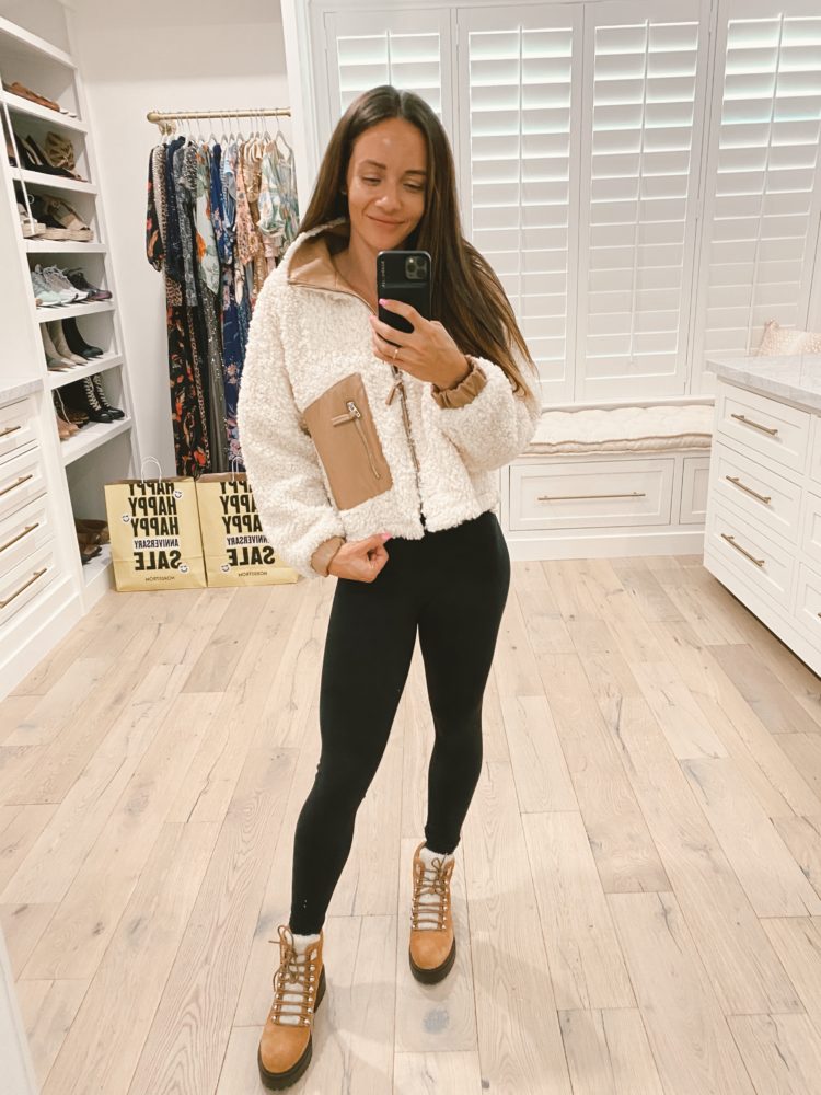 Nordstrom Anniversary Sale 2021 by popular Las Vegas fashion blog, Outfits and Outings: image of a woman white fleece jacket, black leggings, and brown suede combat boots. 