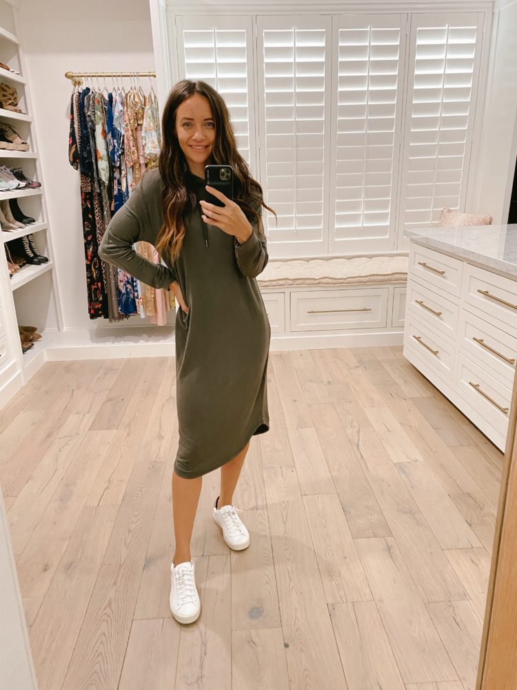 Nordstrom Anniversary Sale 2021 by popular Las Vegas fashion blog, Outfits and Outings: image of a woman wearing a olive green hoodie dress with a pair of white sneakers. 
