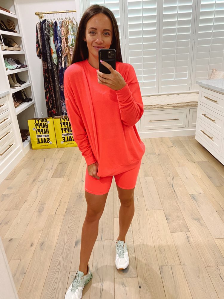 Nordstrom Anniversary Sale 2021 by popular Las Vegas fashion blog, Outfits and Outings: image of a bright red loungewear set with a pair fo white athletic sneakers. 