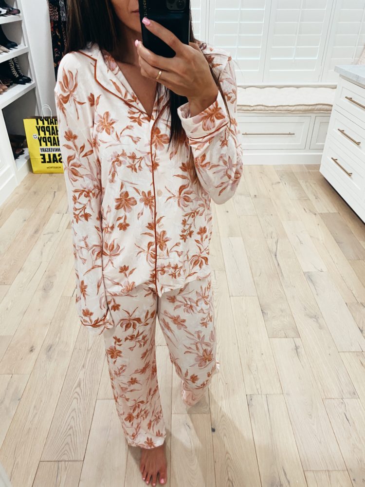 Nordstrom Anniversary Sale 2021 by popular Las Vegas fashion blog, Outfits and Outings: image of a woman wearing a pair of orange white floral print pajama set. 