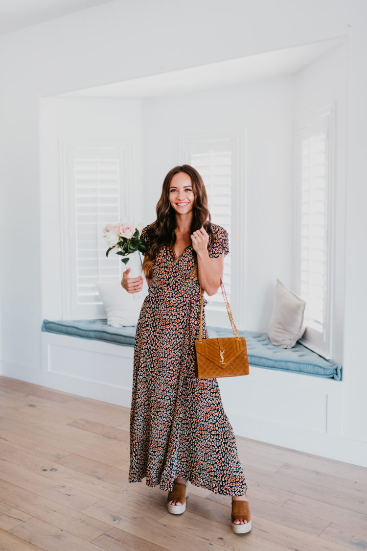 Nordstrom Anniversary Sale 2021 by popular Las Vegas fashion blog, Outfits and Outings: image of a woman wearing a maxi leopard print dress and holding a brown YSL bag. 
