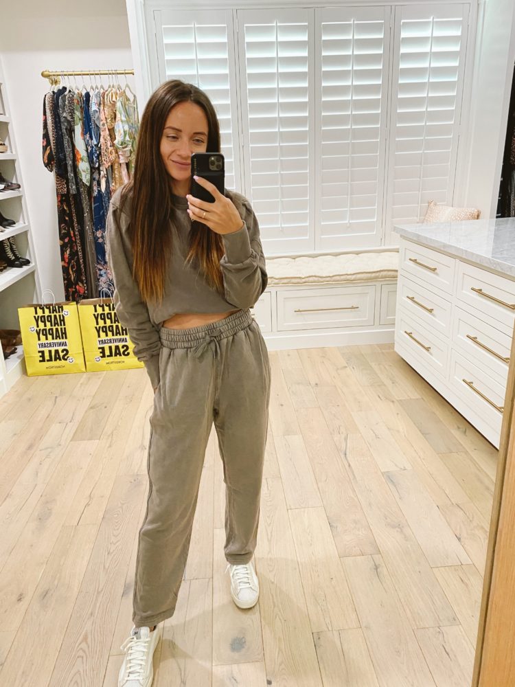 Nordstrom Anniversary Sale 2021 by popular Las Vegas fashion blog, Outfits and Outings: image of a woman wearing a olive green loungewear set with a pair of white sneakers. 