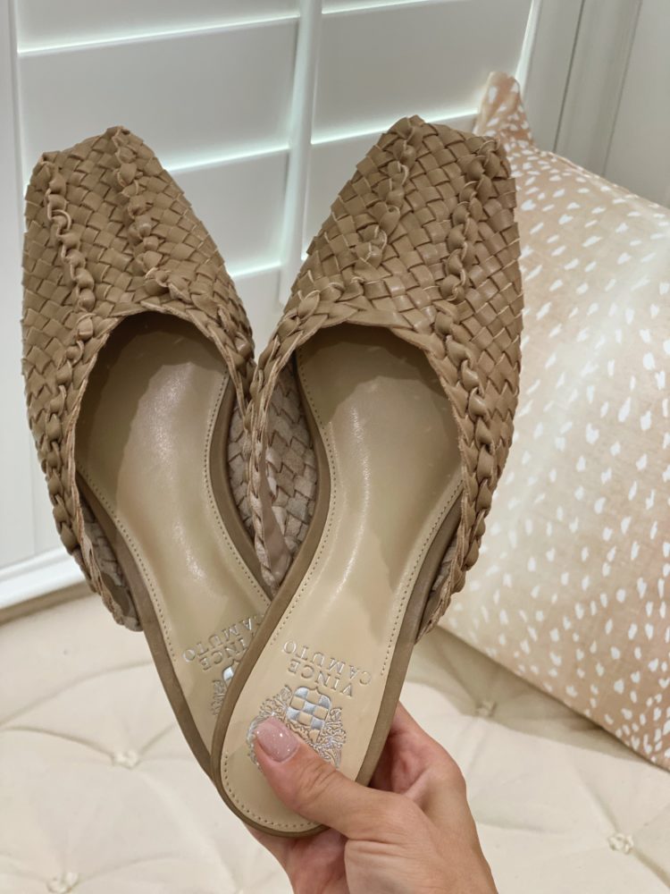 Nordstrom Anniversary Sale 2021 by popular Las Vegas fashion blog, Outfits and Outings: image of a woman holding a pair of braided Vince Camuto slides. 